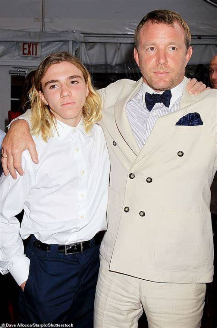 Rocco Ritchie with his father and step mother